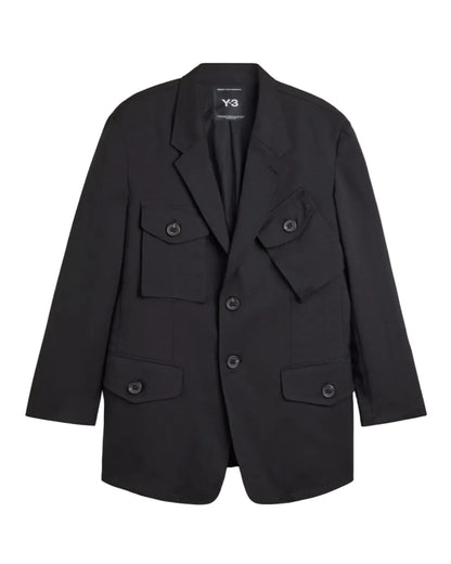 A black Y-3 blazer jacket with multiple flap pockets and a double-breasted button closure, displayed flat against a light gray background.