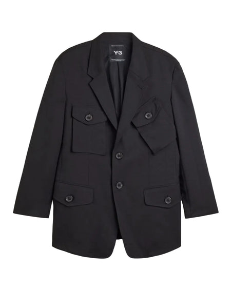 A black Y-3 blazer jacket with multiple flap pockets and a double-breasted button closure, displayed flat against a light gray background.